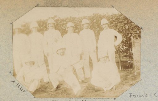 Group portrait of nine men in tropical costume, probably Frenchmen
