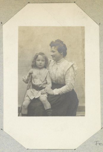 Portrait of a French woman with a girl on her lap