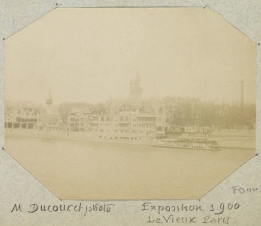 View of a quay with buildings and boats (Le Vieux Paris) during the 1900 World's Fair in Paris