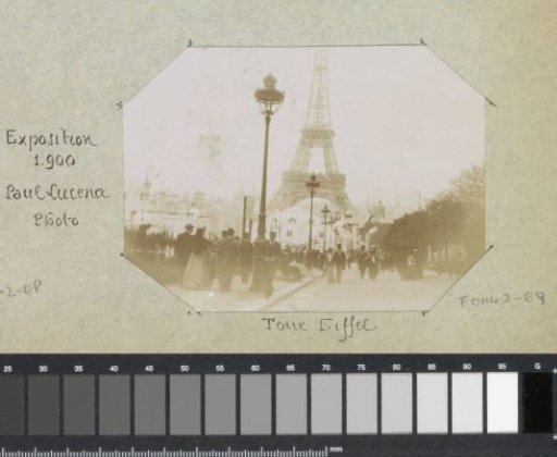 Visitors at the 1900 World's Fair with the Eiffel Tower in the background