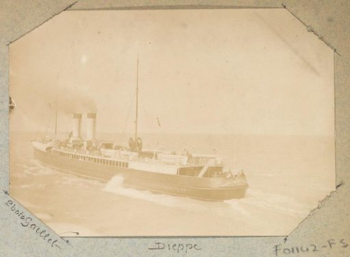 Ship with smoking funnels sailing near Dieppe