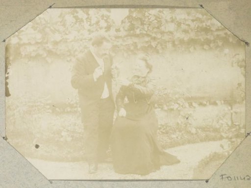 Portrait of a man and a woman in a garden, presumably in France