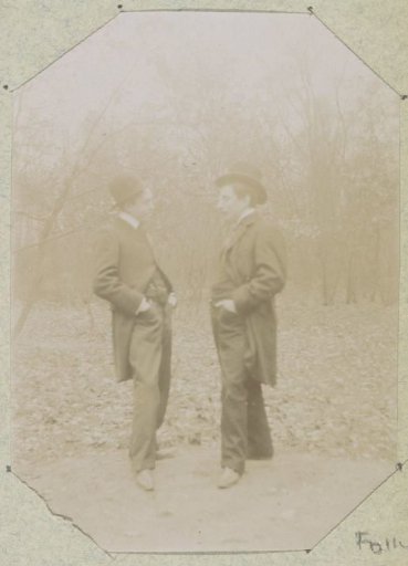 Portrait of two men with their hands in their pockets, presumably in France