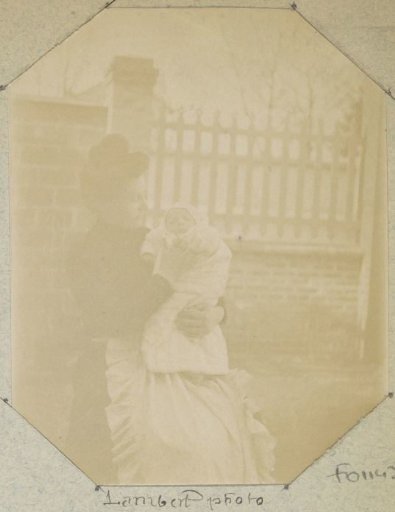 Portrait of a woman with a baby in her arms, presumably in France