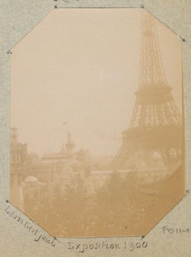 View of the grounds of the World's Fair of 1900 in Paris with the Eiffel Tower on the right and an advertisement for LU biscuits (Lefèvre Utile) on the left