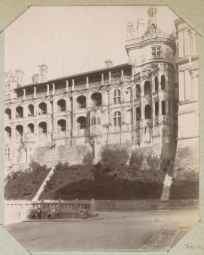 Exterior of the Château of Chambord with a group of people in front of it