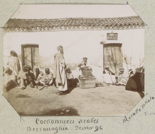 Shoemakers in front of a café in Berrouaghia (Algeria)