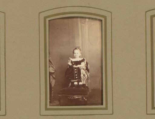 Portrait of a Toddler Standing on a Chair
