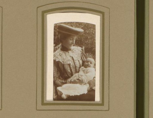 Portrait of a woman with a baby on her lap