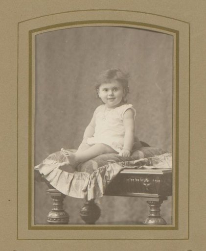 Portrait of a Toddler on a Cushion