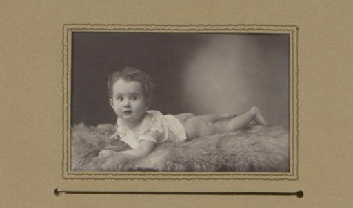 Portrait of a reclining, half-naked child