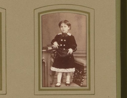 Portrait of a girl standing on a chair