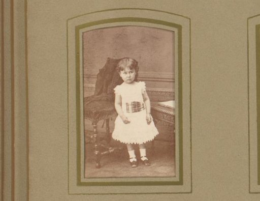 Portrait of a girl before a chair