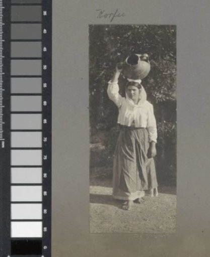 Portrait of a woman with a jug on her head on Corfu