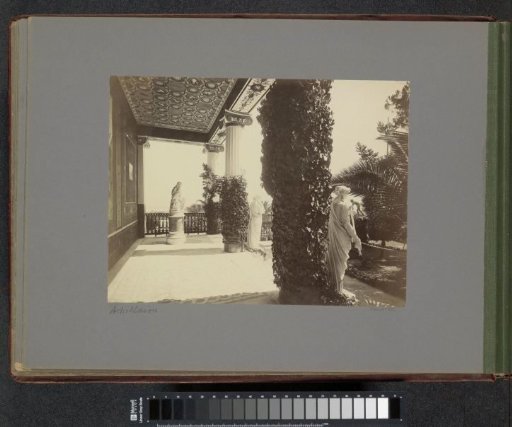 Gallery of statues with ivy and palms at the Achilleion on Corfu