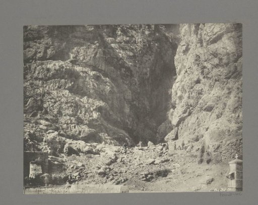 People with jugs and donkeys at the Castalian Spring in Delphi