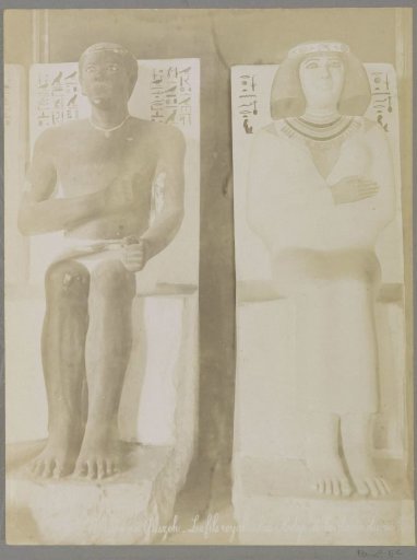 Statues of a pharaoh's son and a queen in the museum of Giza