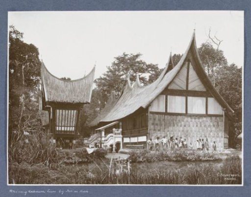 Children posing in front of a dwelling house in Minangkabau in Sumatra