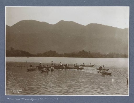 View of Lake Maninjau in Sumatra with fishermen in canoes