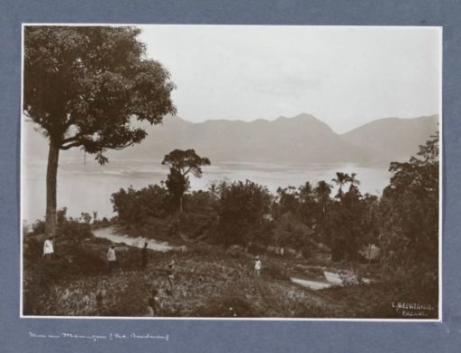 View of Lake Maninjau in Sumatra with agricultural workers in the foreground