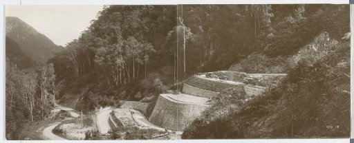 Road with hairpin bends, cars and a cart between Paja Kombo and Bangkinan on Sumatra