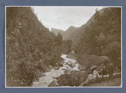 View of a gorge near Ajer Puteri, a woman and two men in the foreground