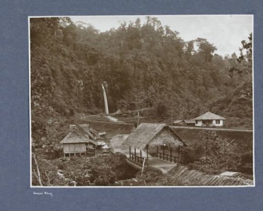 Houses and waterfall along a railway track in the Anai Gorge on Sumatra