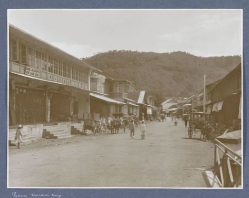 Street in the Chinese Quarter in Padang with on the left the building of 'Trading Company Kong Tjiang Loeng formerly Ma A Sie'