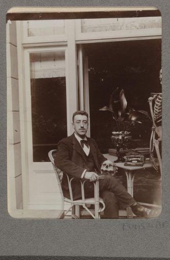 Portrait of Christiaan Otto Roelofs sitting in front of a house