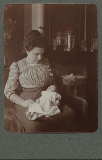 Portrait of a woman with a baby on her lap