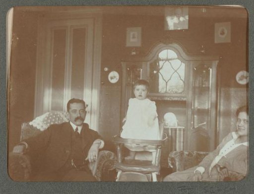 Portrait of a man, a woman, and a child in an interior