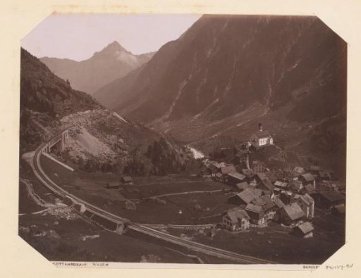 View of the Gotthard Railway at Wasen with mountains and dwellings