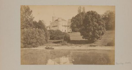 Castle by a lake with a boat, probably in Germany