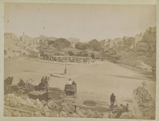 City square with destroyed buildings, presumably in Egypt after an earthquake