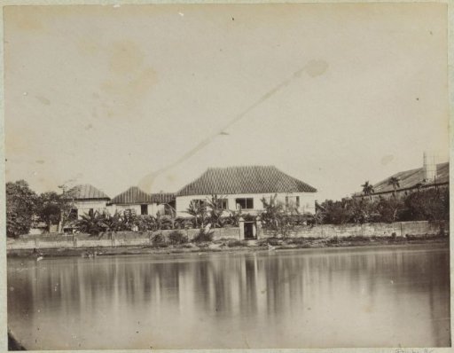 House by a lake, possibly in the Philippines