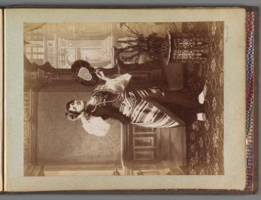 Portrait of a girl in Eastern dress with a fan