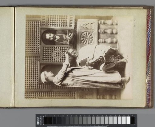 Portrait of a barber, a customer with a mirror and a servant with a basin