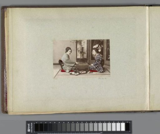 Portrait of two Japanese women during a board game