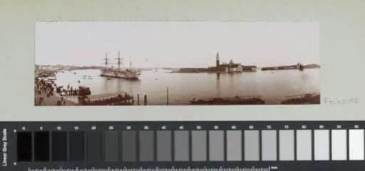 View of quays and San Giorgio Maggiore in Venice with a sailing ship on the Canale della Giudecca in the foreground