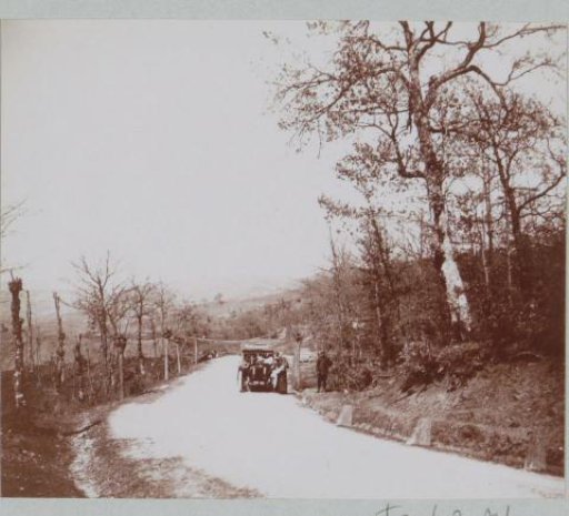 Car by the roadside, presumably in Northern Italy, woman reading a map