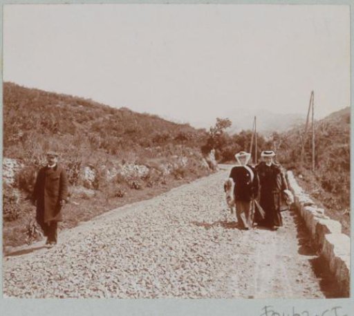 Two Women and a Man Walking Along a Road, Probably on Corsica
