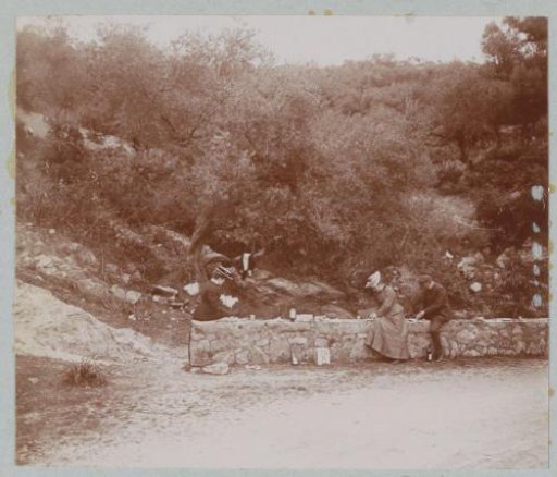 Two Women and a Man Picnicking by the Side of the Road, Probably on Corsica