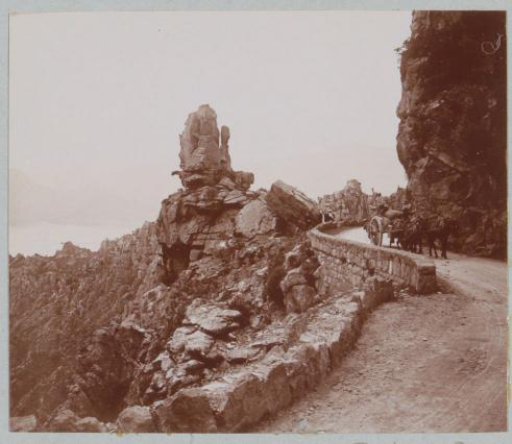 Horse and cart near a rock formation, probably in Corsica