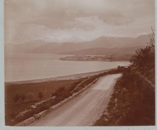 View of a coastal strip of Corsica with a city in the background