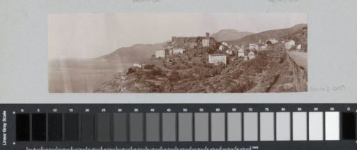 View of a seaside village with a Genoese tower on Corsica