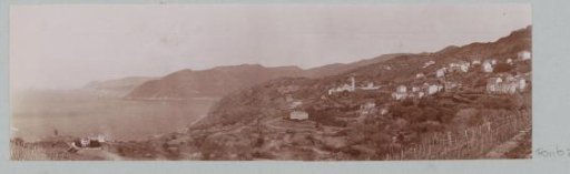 View of a seaside village with a Genoese tower on Corsica