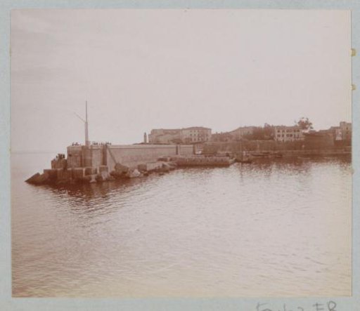 View of a harbor pier, presumably on Corsica