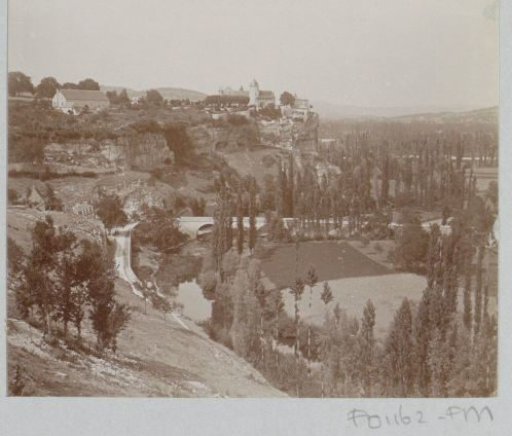 Landscape with a town on rocks and a valley with a river in France