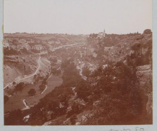 View of a river valley in France with a city in the distance