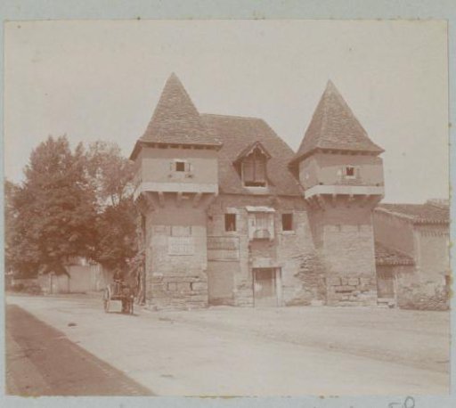 Building with two towers in France with advertising signs for chocolate